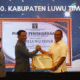 Bupati Luwu Timur Terima Penghargaan Kemenkum Sulsel atas Pembentukan 100 Persen Posbankum